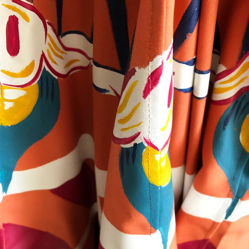 detail of a colorful patio umbrella by pearl and maude