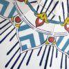 detail of an elegant blue and white patio umbrella by pearl and maude
