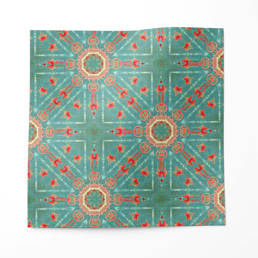 An mage of a swatch of Beaufort Spanish medallion linen fabric in turquoise and coral.