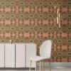 Pearl & Maude's tropical botanical Artemis nonwoven vellum wallpaper in dark clay pink and moss green installed in a beautiful living room with white and brass furniture.