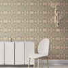 Pearl & Maude's tropical botanical Artemis nonwoven vellum wallpaper in light clay pink and moss green installed in a beautiful living room with white and brass furniture.