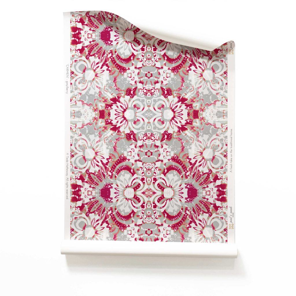 A roll of Carmen grey and magenta botanical wallpaper featuring abstract floral patterns in neutral grey and vibrant magenta, perfect for bold and artistic interiors.