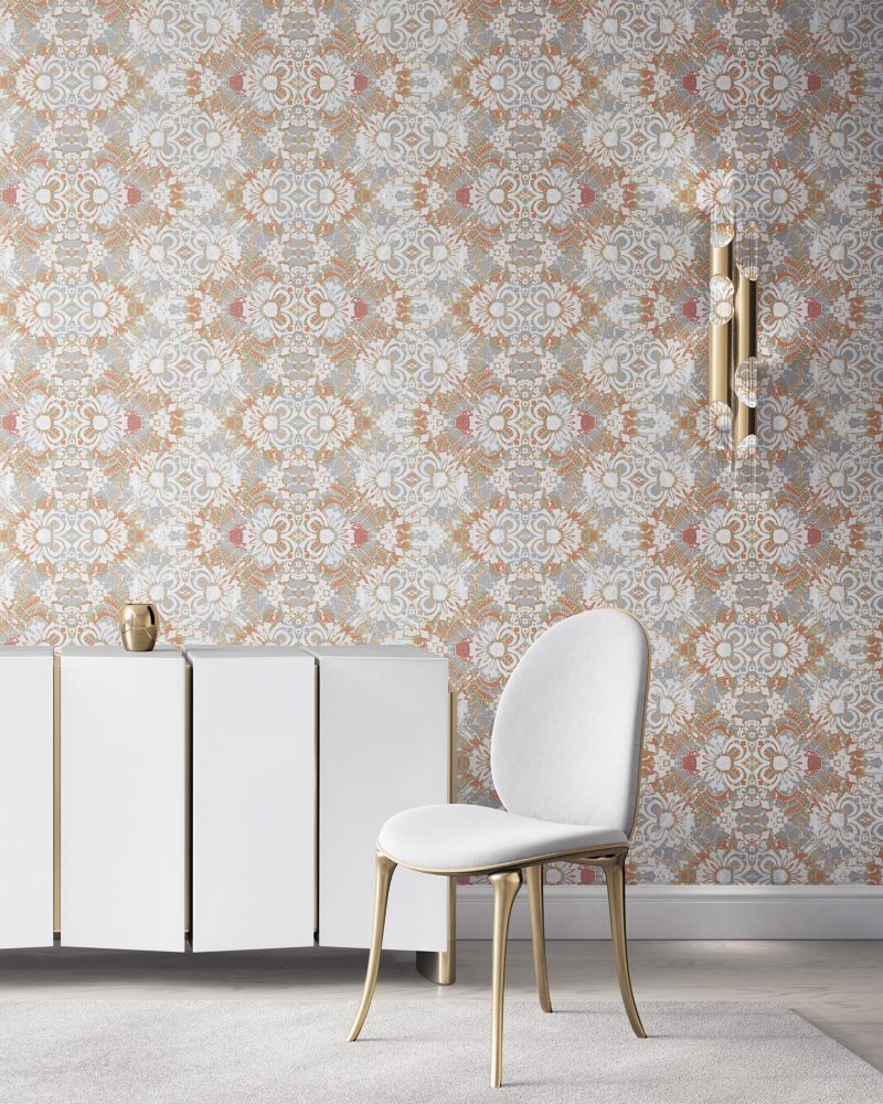 Pearl & Maude's abstract botanical Carmen nonwoven vellum wallpaper in clay pink, white and grey installed in a beautiful living room with white and brass furniture.