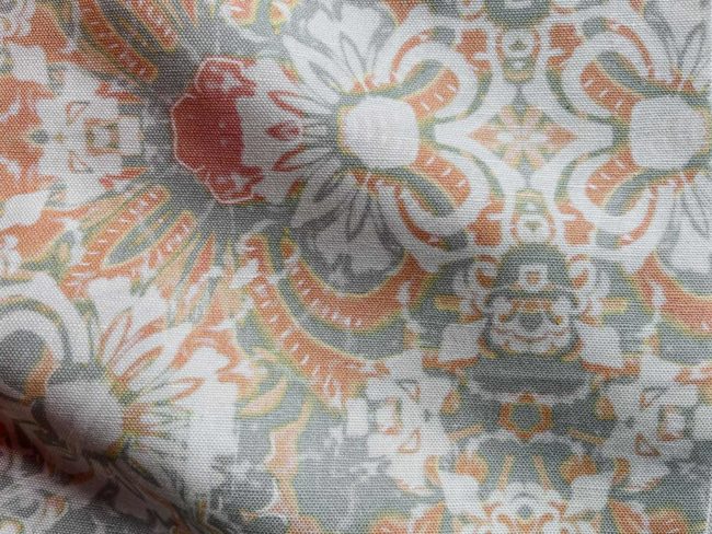 A fabric swatch of Pearl & Maude's abstract floral Carmen in clay pink and grey