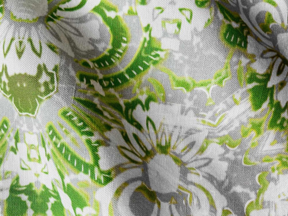 A fabric swatch of Pearl & Maude's abstract floral Carmen in moss green and grey