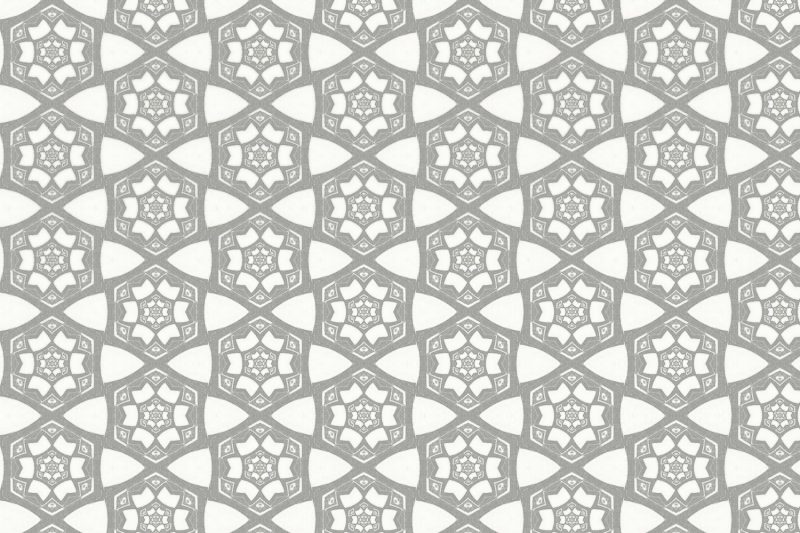 A detail swatch Pearl & Maude's small hexagon Cora nonwoven wallpaper in grey and white