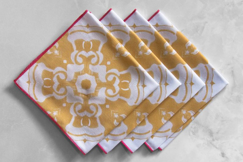 Alexandria Cloth Cocktail Napkin in daisy yellow is a fun, symmetrical pattern