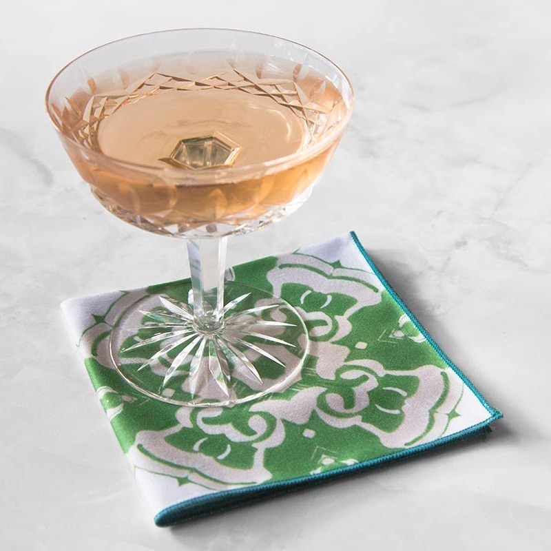 Alexandria Cloth Cocktail Napkin in moss green with a crystal wine glass