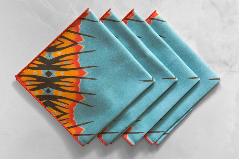 Desert Diamond Cloth Cocktail Napkin is a funky blue and orange pattern