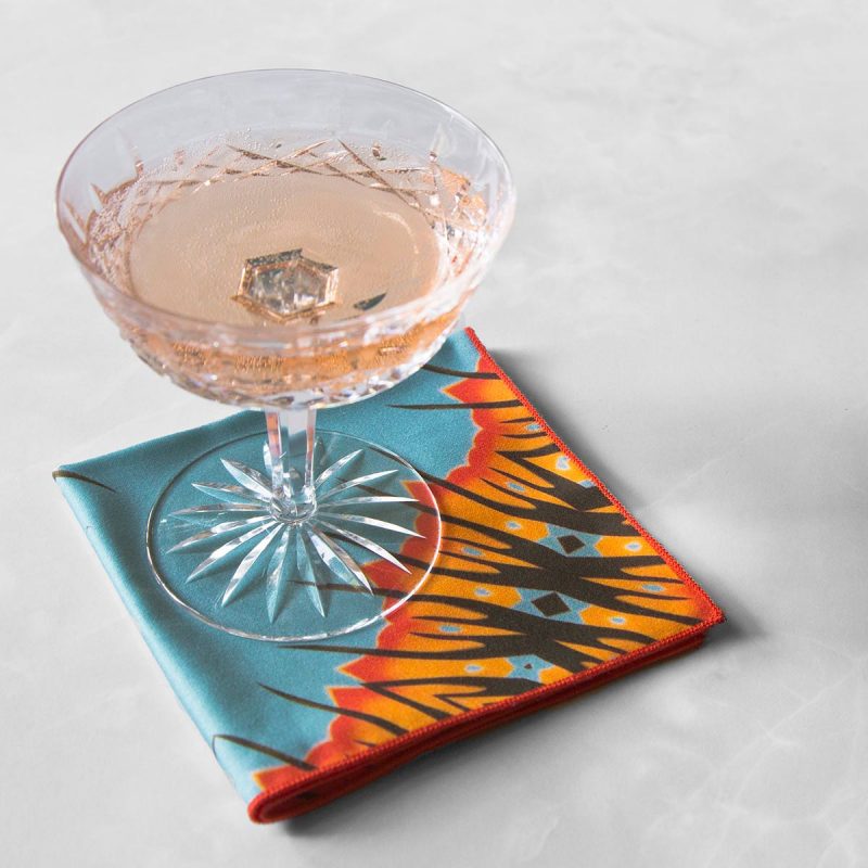 Desert Diamond Cloth Cocktail Napkin with a crystal wine glass.