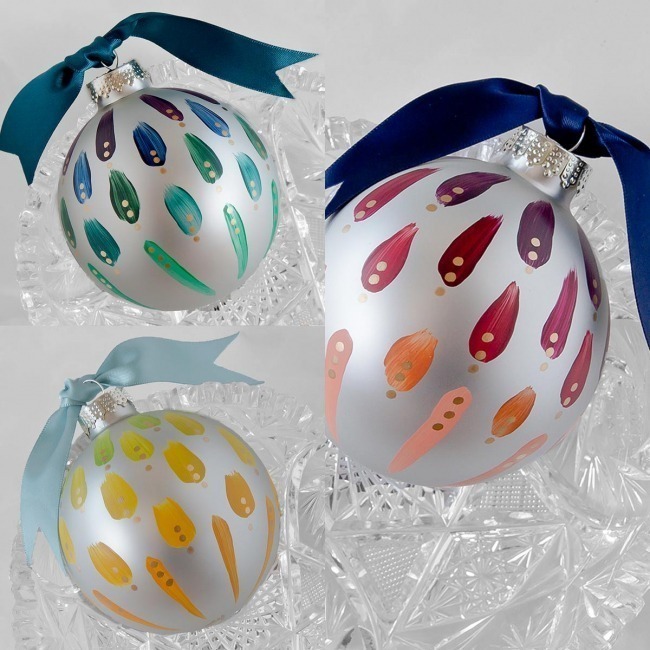 A set of three hand painted christmas ornaments in a city inspired, vibrant color palette