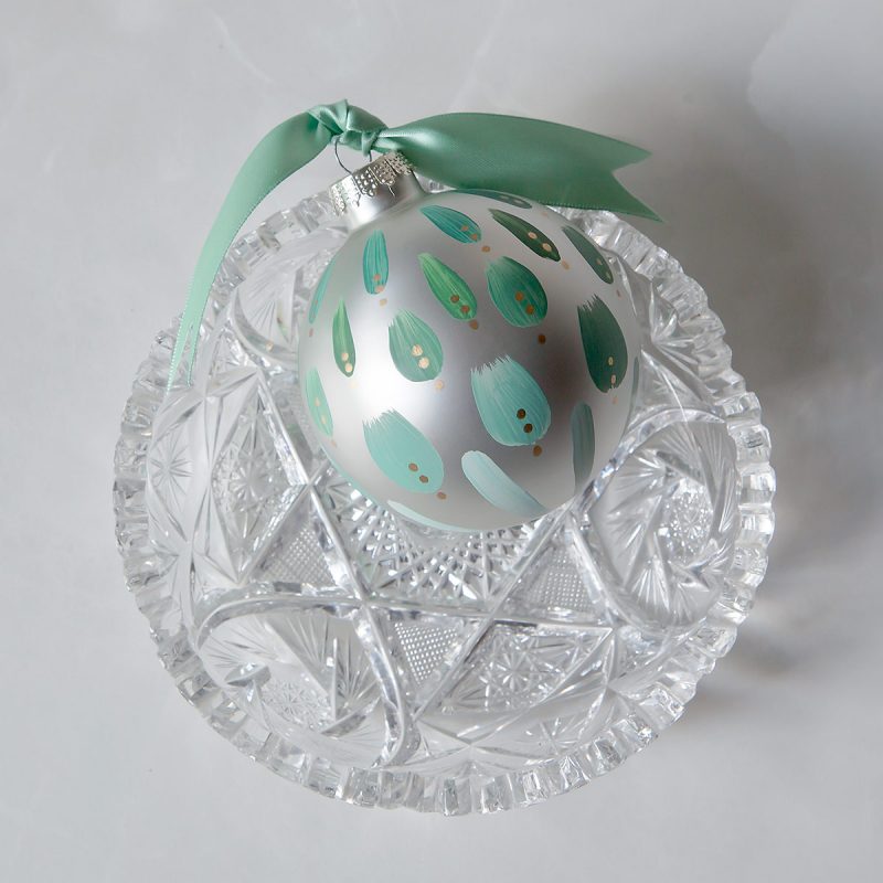 sage dreams green christmas ornament is hand painted in soft green hues