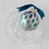 Steppin Out blue green hand painted ornament has all the flair of a peacock