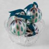 Steppin Out glass Christmas tree ornaments are vibrant holiday decorations