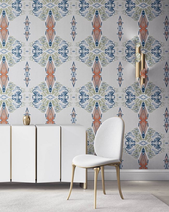 Linn grey bohemian wallpaper installed in a dining room with brass furniture.
