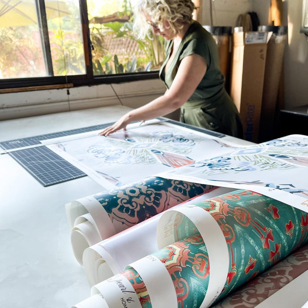 Cutting Samples of wallpaper in the Pearl & Maude Studio - Teale Hatheway