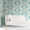 Carmen Inlay wallpaper in Surf colorway installed in a living room. It is an abstract floral pattern in ocean blue and sandy brown.