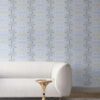 Room wallpapered in silver blue and cream colored trellis wallpaper. Design - Arachne by Pearl and Maude