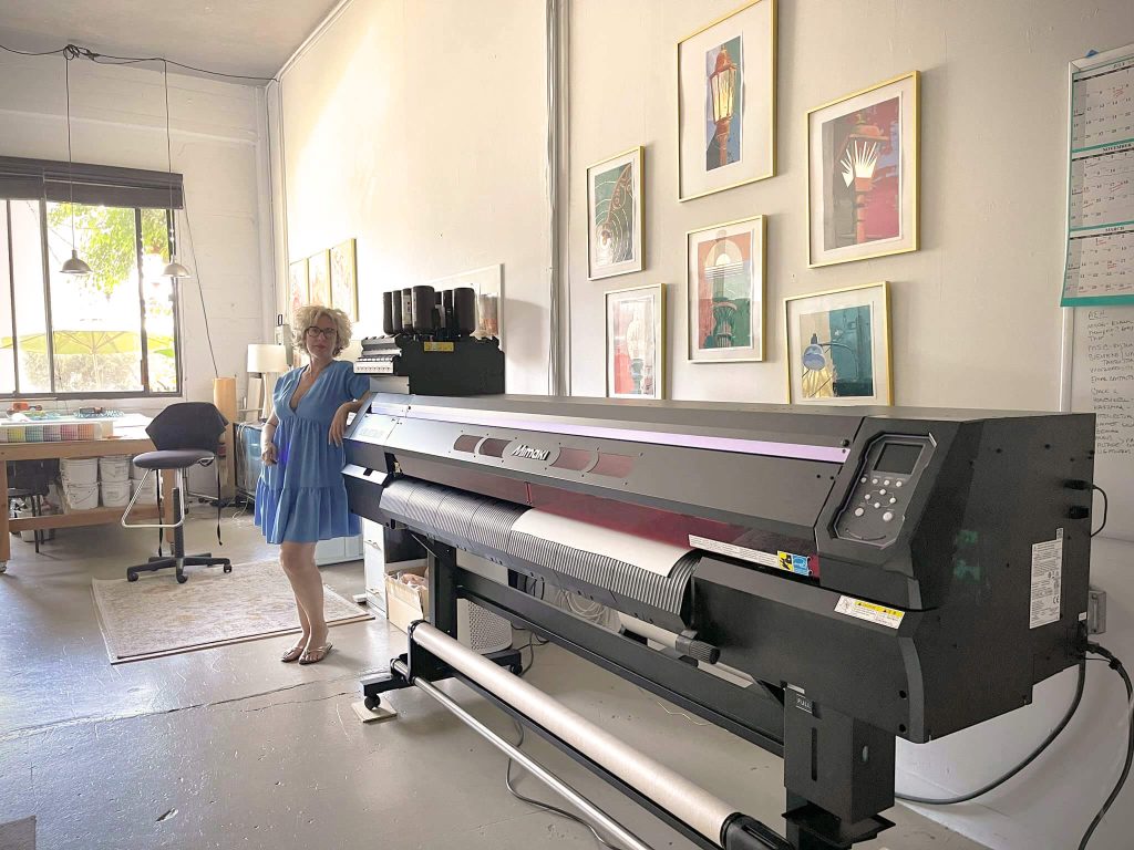 Teale Hatheway, founder of Pearl & Maude with her large format digital printer for wallpaper