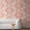 Carmen Inlay wallpaper in Redwood colorway installed in a living room. It is an abstract floral pattern in rust red and sandy brown.