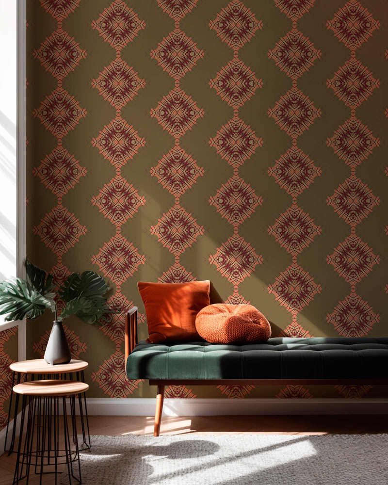 Desert Diamonds brown and pink patterned wallpaper in installed in a living room interior designed with a green velvet bench and pretty daylight. Large sized repeat