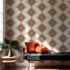 Desert diamonds wallpaper in cream and apricot colors installed in a living room interior with a green velvet bench and pretty daylight. Large sized repeat