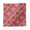 A swatch of Marshan red ornate patterned fabric that blends Americana style with Eastern pattern motifs