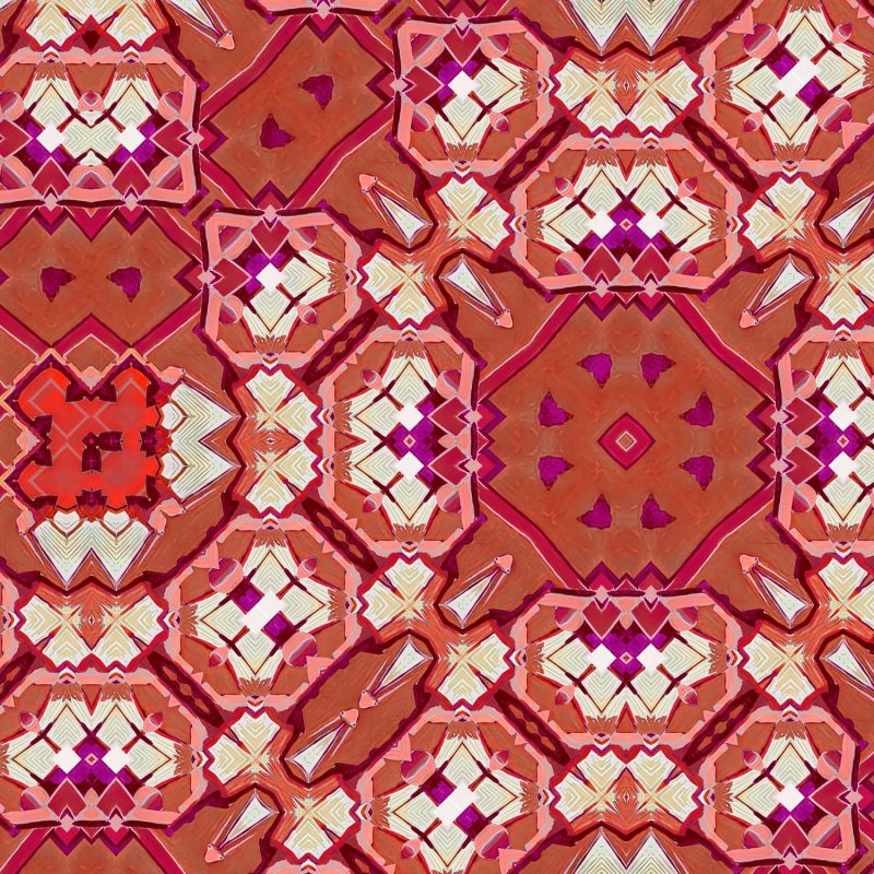 A detail of Marshan red ornate patterned fabric that blends Americana style with Eastern pattern motifs in a bohemian style fabric