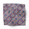 A swatch of Marshan blue ornate patterned fabric that blends Americana style with Eastern pattern motifs