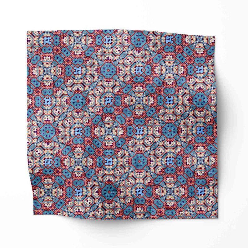 A swatch of Marshan blue ornate patterned fabric that blends Americana style with Eastern pattern motifs
