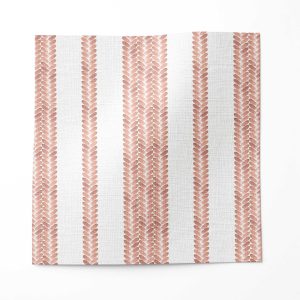 A swatch of Perigrene drapery fabric in colorway Dawn. It is a woven stripe fabric in pink, peach and white colors. It's an ideal fabric for draperies.