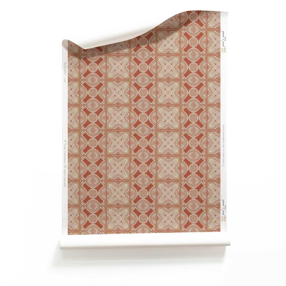 A roll of Ruguru red geometric tile wallpaper, with intricate patterns, in rust, white and brown