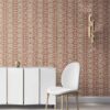 our Ruguru geometric tile wallpaper, with an intricate repeat, in the Rust Red and beige colorway. Installed on the wall of a room interior decorated with fine white velvet seating and high end furniture
