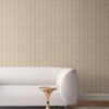 our Ruguru geometric tile wallpaper, with an intricate repeat, in the silt brown and beige colorway. Installed on the wall of a room interior decorated with fine white velvet seating and high end furniture