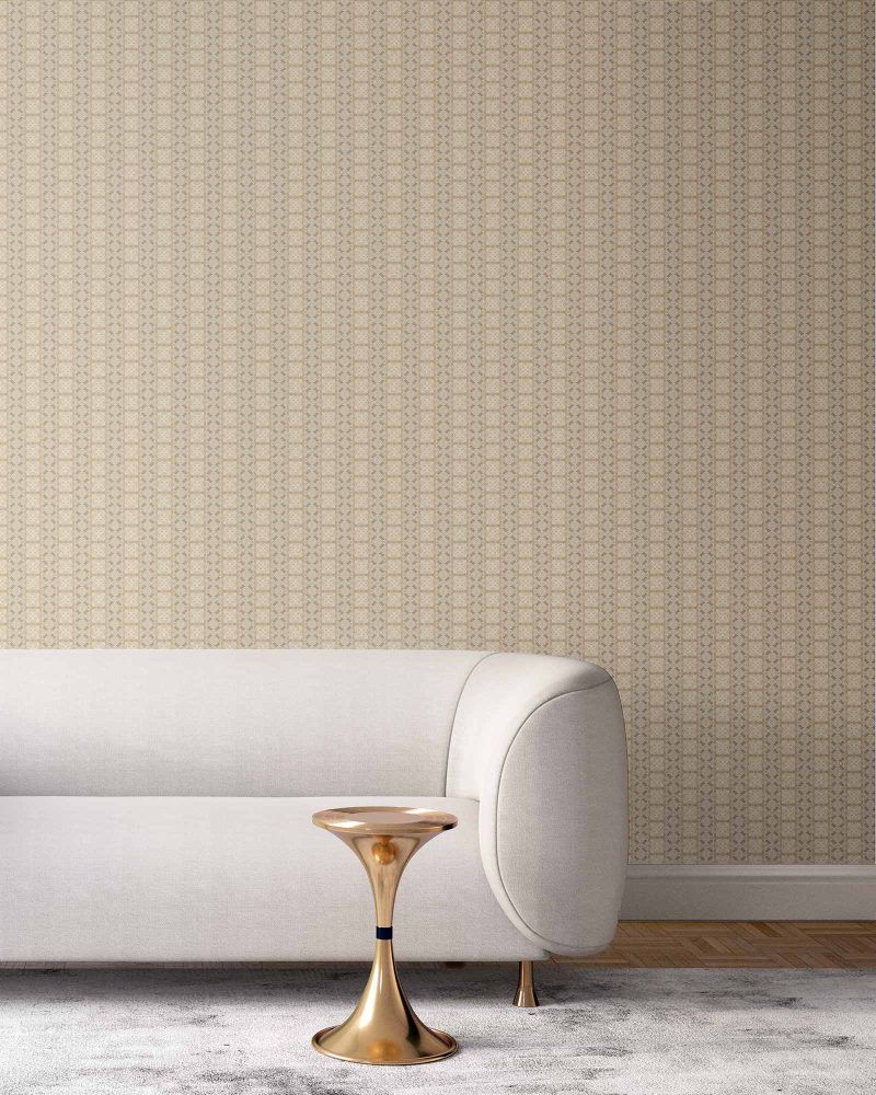 our Ruguru geometric tile wallpaper, with an intricate repeat, in the silt brown and beige colorway. Installed on the wall of a room interior decorated with fine white velvet seating and high end furniture