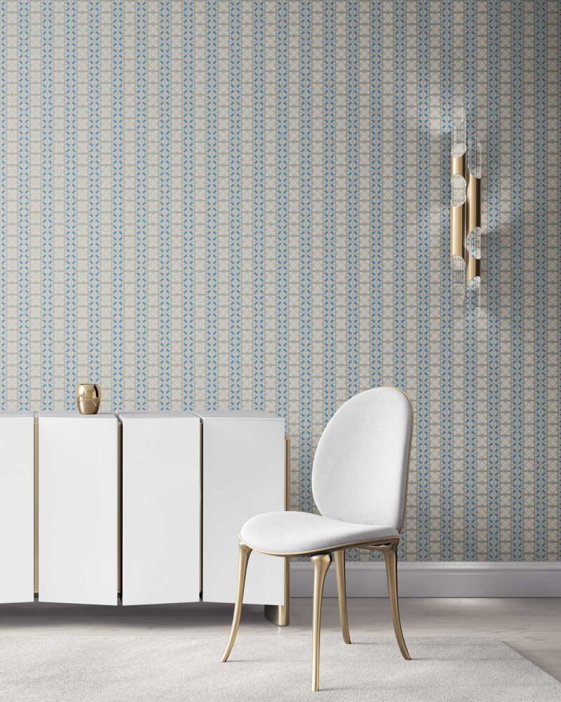 our Ruguru geometric tile wallpaper, in a small repeat, in the Spring Blue and beige colorway. Installed on the wall of a room decorated with fine white velvet seating and high end furniture