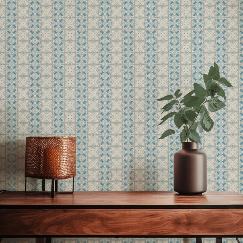 A closeup view of our Ruguru geometric tile wallpaper in the Spring Blue and beige colorway. Installed on the wall of a room decorated with fine wood furniture