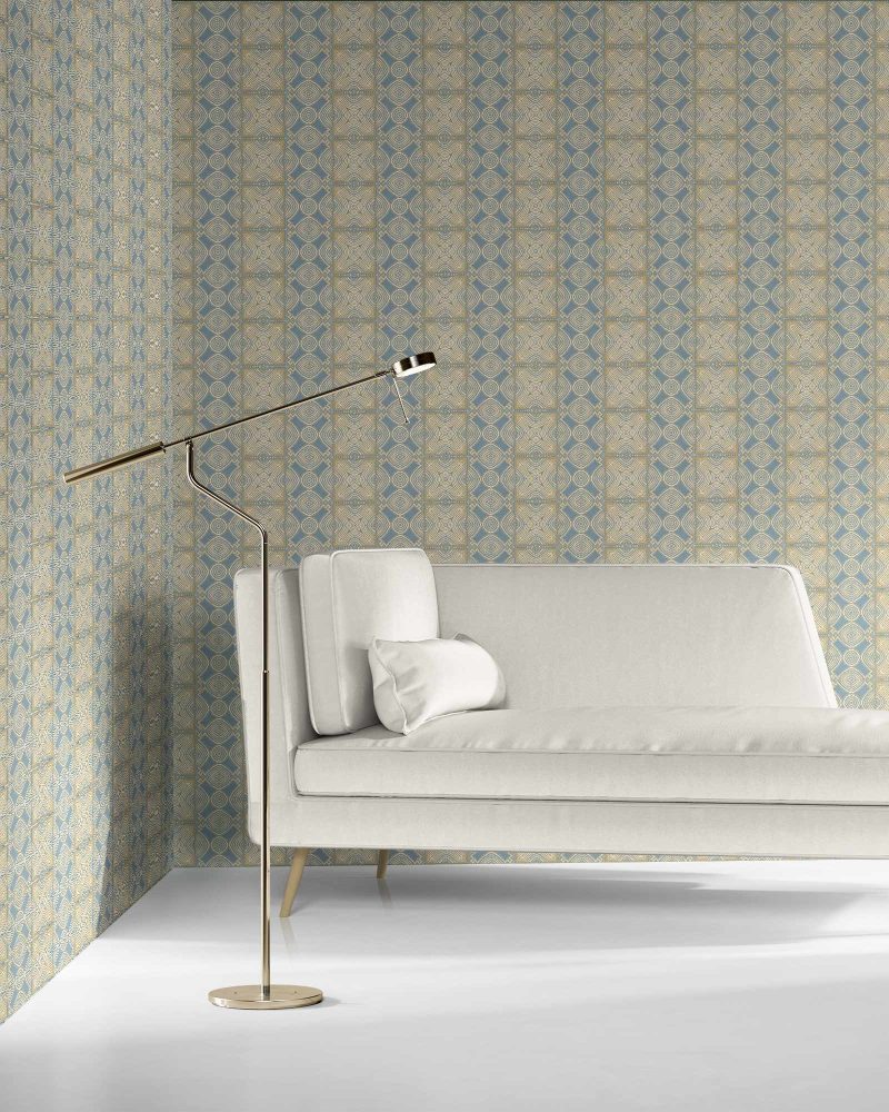 our Ruguru geometric tile wallpaper, with an intricate repeat, in the Spring Blue and beige colorway. Installed on the wall of a room decorated with fine white velvet seating and high end furniture