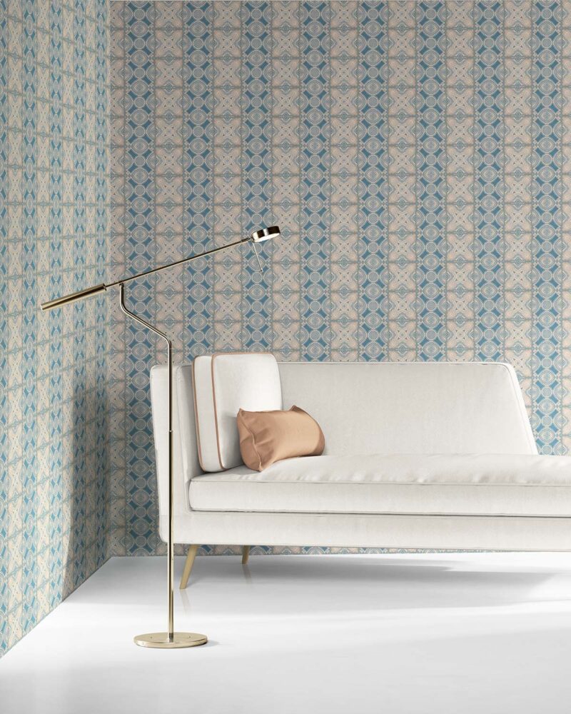 our Ruguru geometric tile wallpaper, with an intricate repeat, in the Spring Blue and beige colorway. Installed on the wall of a room decorated with fine white velvet seating and high end furniture