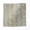 A swatch of "Ruguru" - an enchanting linen fabric pattern that showcases intricate linework, crafting a mesmerizing blue tribal patterned fabric in a small, textural pattern.