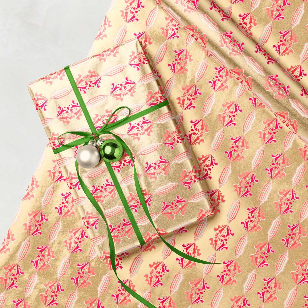 metallic gold and pink Christmas wrapping paper rolls