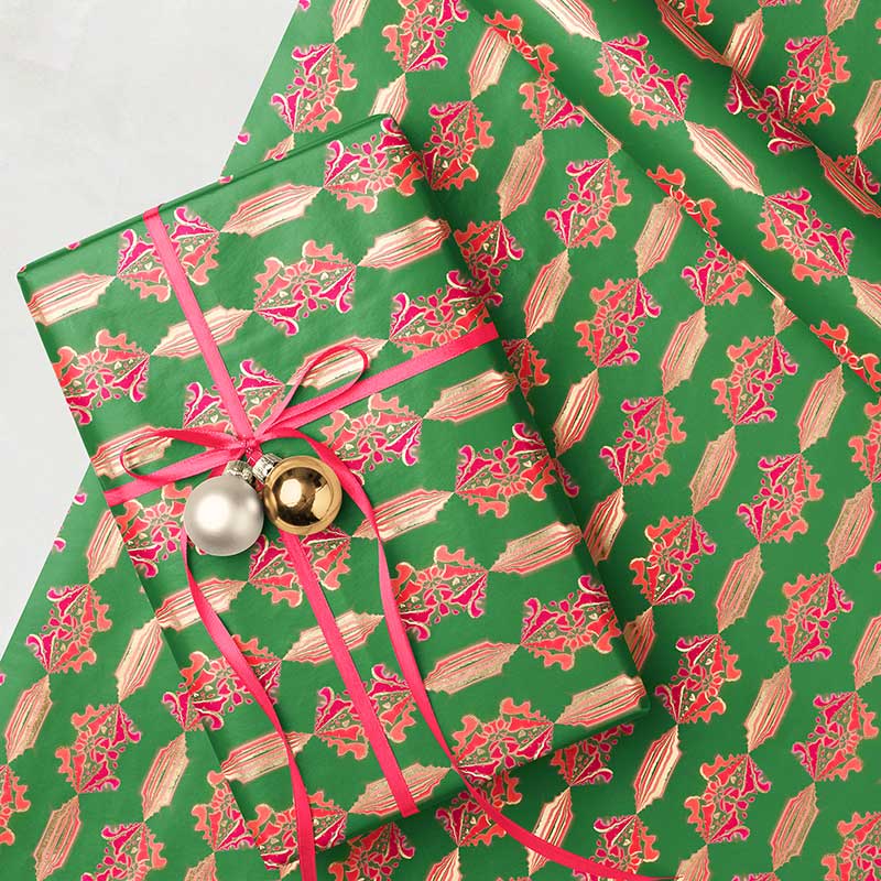 green pink gold Christmas wrapping paper rolls