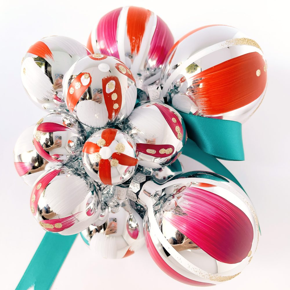 Hand painted Christmas ornament cluster in red, magenta and white with gold glitter and teal satin ribbon.