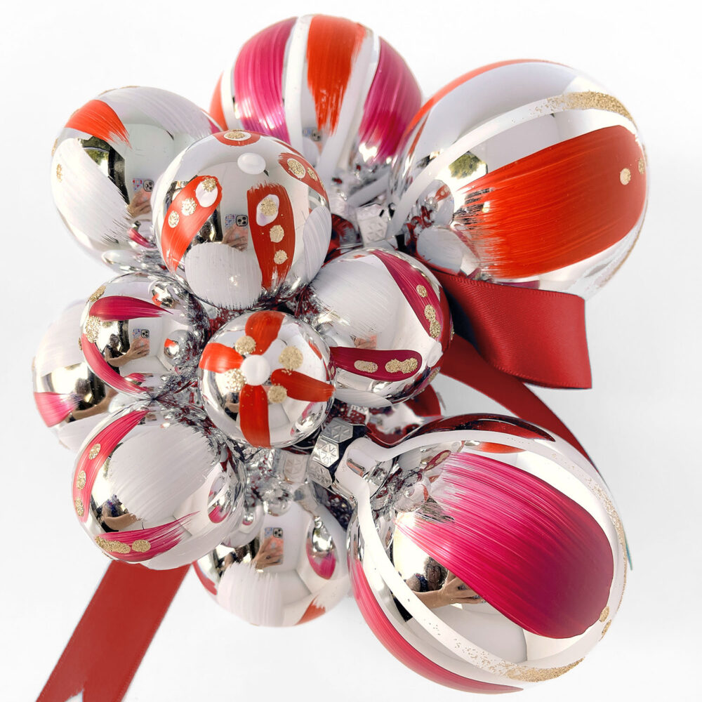 Hand painted Christmas ornament cluster in red, magenta and white with gold glitter and ivory satin ribbon.