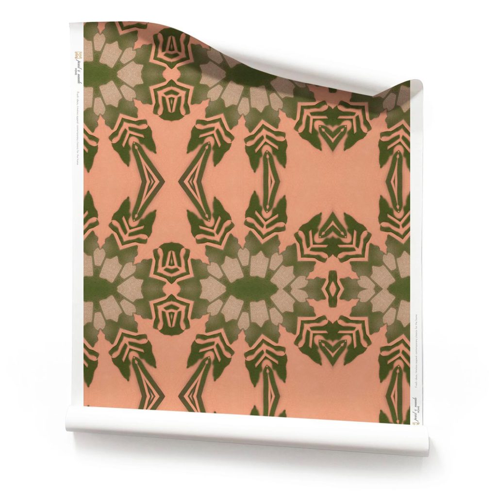 A roll of Pearl & Maude's Artemis - Terracotta Tropical Wallpaper with Olive Green Foliage, on a white background. An orange artisan wallpaper. Roll of terracotta tropical wallpaper with moss green foliage, featuring a bold botanical pattern inspired by sunset gardens.; Green & Terracotta Tropical Wallpaper