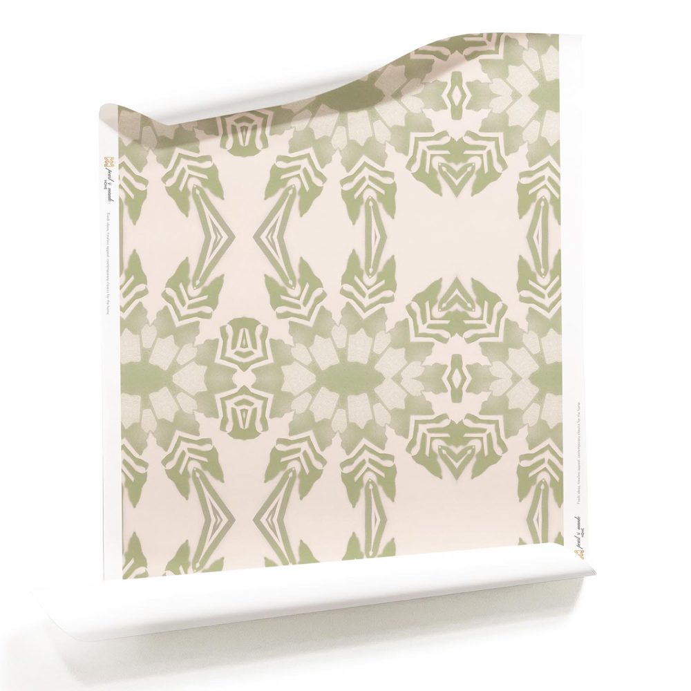 A roll of Artemis, Pearl & Maude's light pink tropical wallpaper in very light pink and soft green