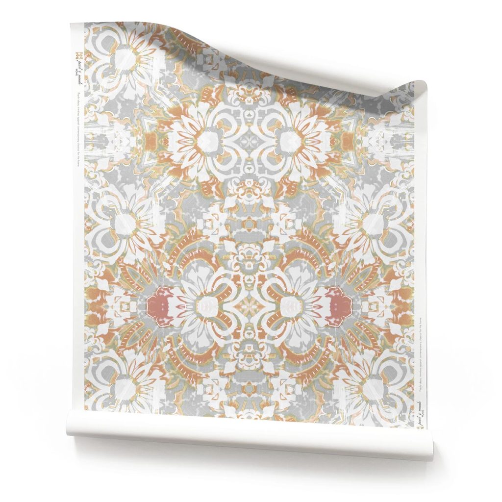 a roll of Carmen grey blush floral wallpaper featuring warm peach and cool grey tones with intricate floral patterns, ideal for pairing with marble.