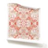A roll of Carmen red and pink botanical wallpaper in colorway Redwood. It is an abstract floral fabric in rust, pink, brown and white colors. It's an ideal wallpaper for inviting dining rooms. Carmen Redwood Clay Coated Wallpaper Roll- Carmen red pink floral wallpaper in earthy tones of pink, beige, red, and white, featuring delicate floral patterns with a warm and natural aesthetic.