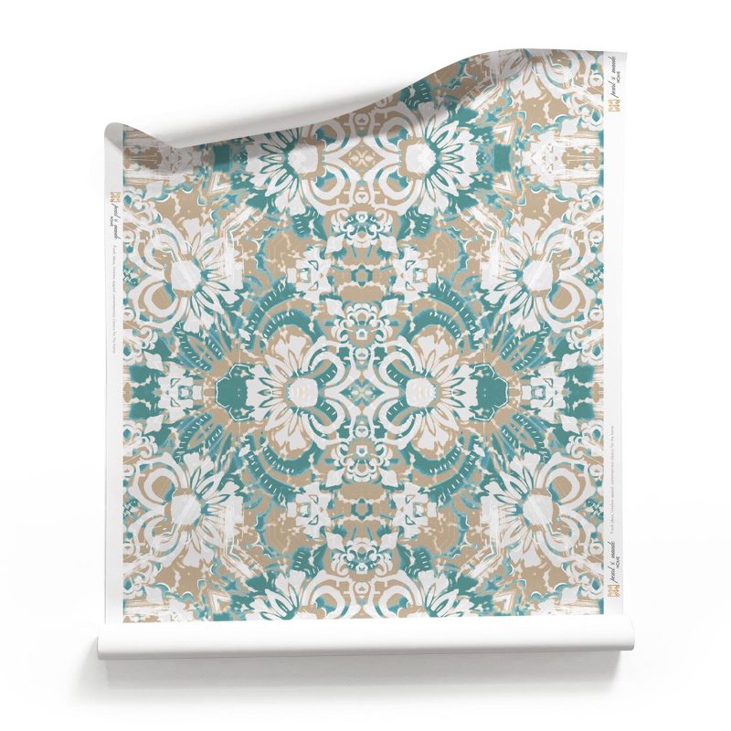 a roll of Carmen Blue Floral Wallpaper with soft sandy beiges and white lacy layers