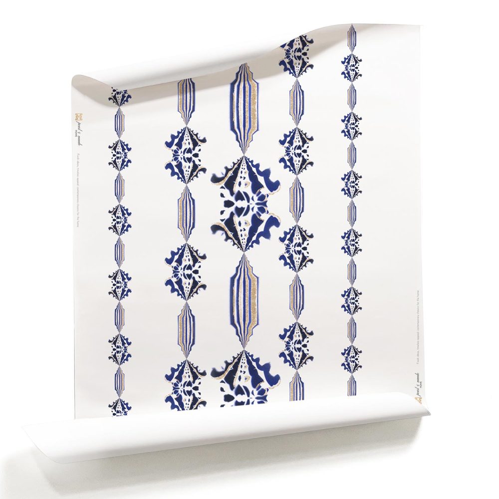 A roll of Charlie, Pearl & Maude's blue flower stripe wallpaper in sapphire blue and white